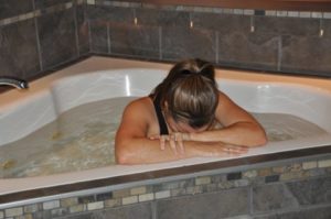 Birthing woman in tub